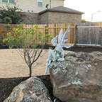 Statue of sitting fairy in the garden