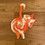 Sweet knitted kitten butt coasters