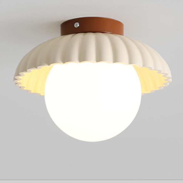 Ceiling lamp with a milk glass shade providing warm lighting in the hallway