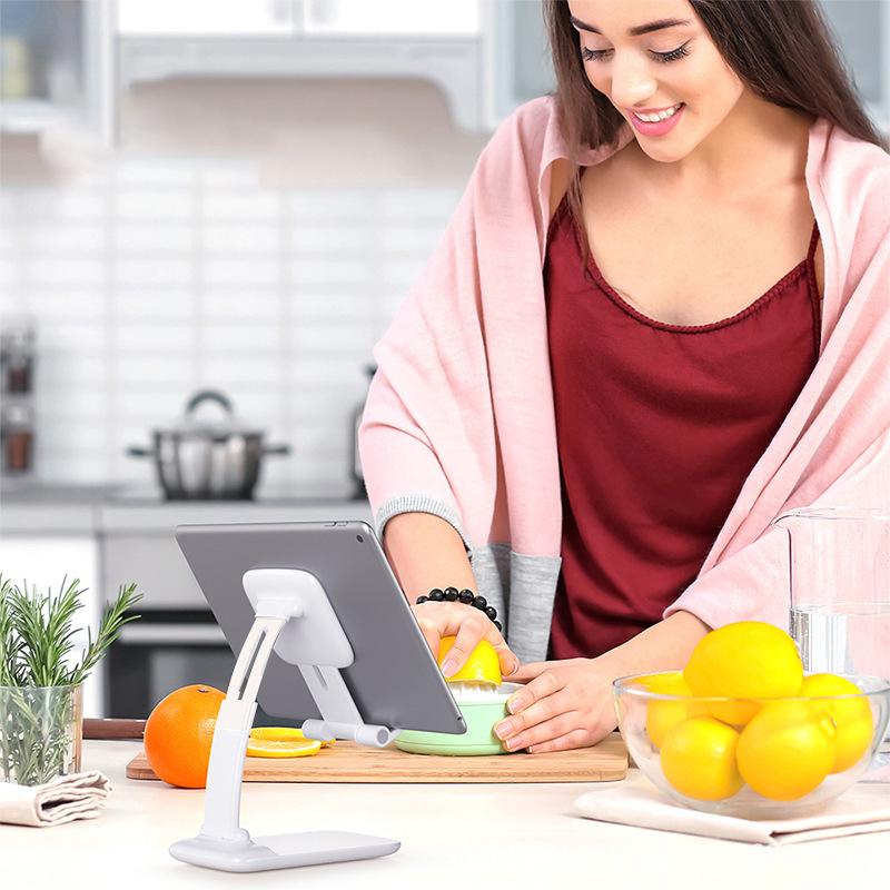 Adjustable and foldable mobile phone stand