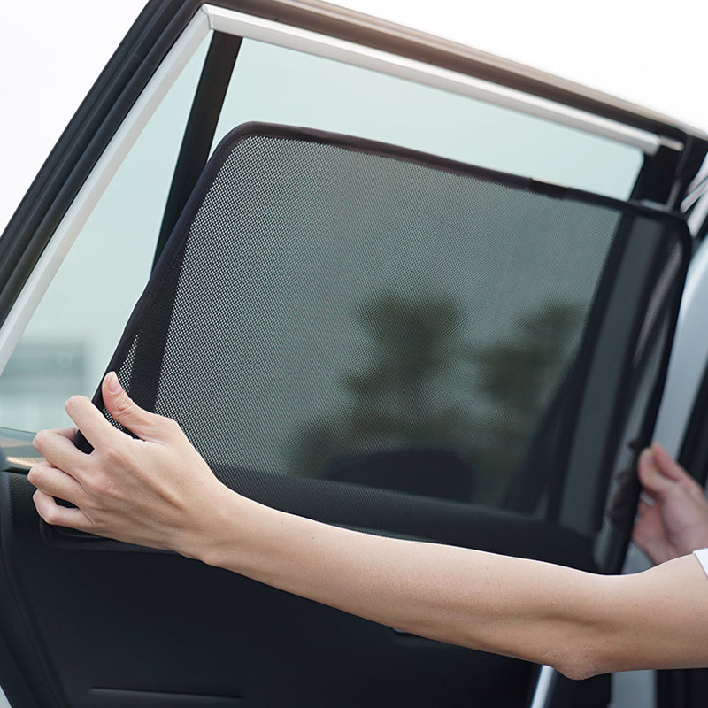Magnetic holder for car window shade dispenser