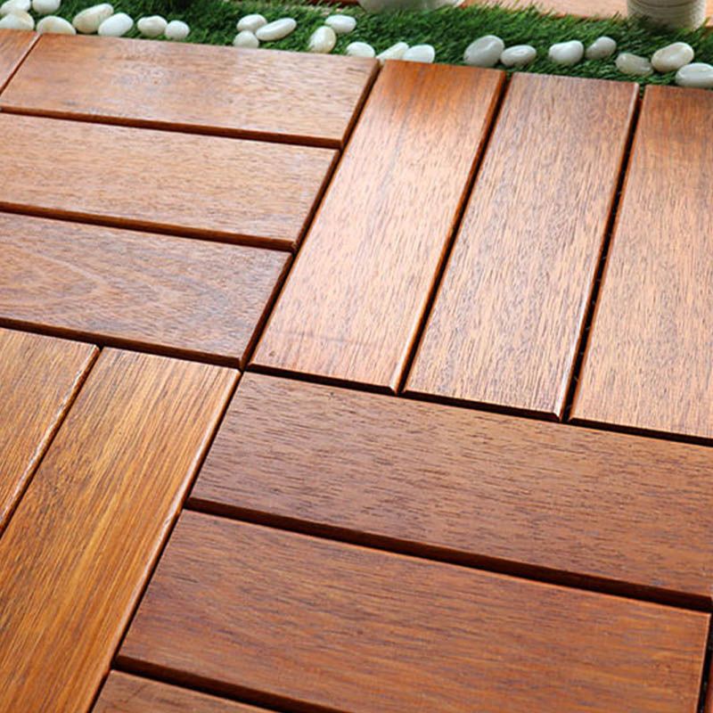 Classic wooden deck tiles connecting composite patio tiles