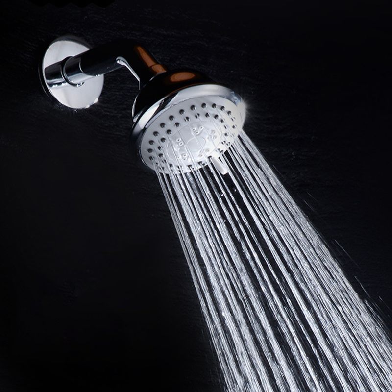 Round shower head made of stainless steel in silver wall-mounted shower head