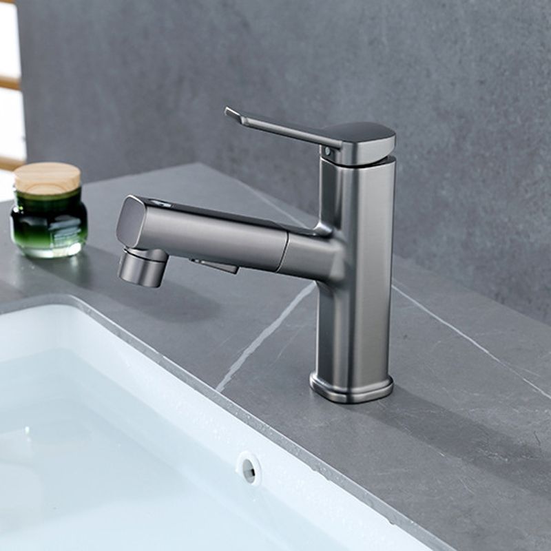 Modern bathroom sink faucet with brass lever handles and swivel spout