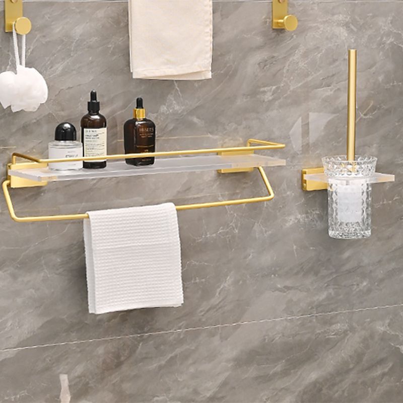 Metal and acrylic bathroom accessories as a single piece or in a set in gold