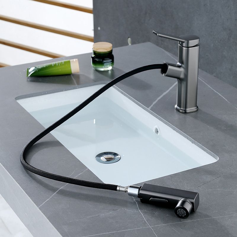 Modern bathroom sink faucet with brass lever handles and swivel spout