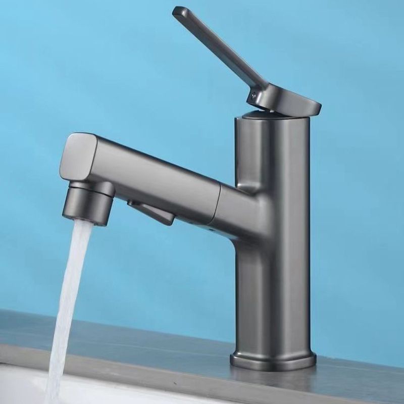 Modern bathroom sink faucet with brass lever handles and swivel spout