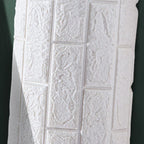 Modern wall-ceiling element for sticking with 3D embossing in white