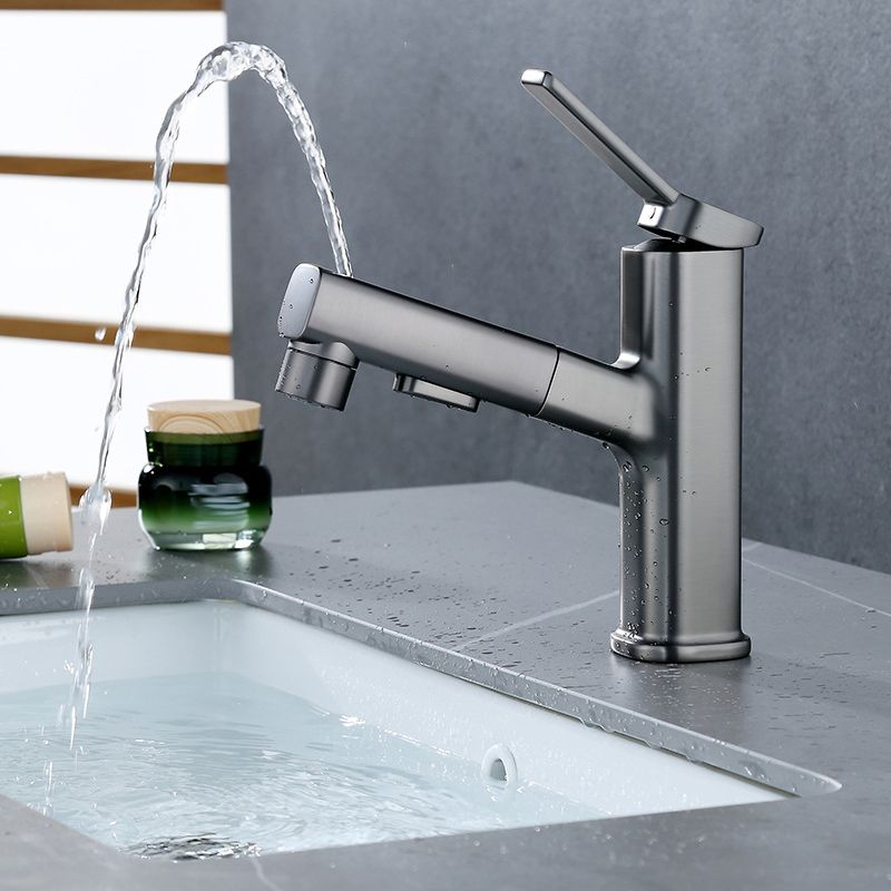 Modern bathroom sink faucet with brass lever handles and swivel spout