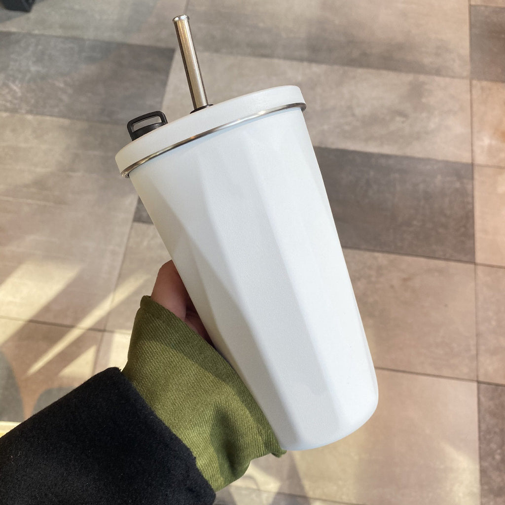 Cup with collapsible straw