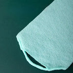 Stretchable back brush bath towel