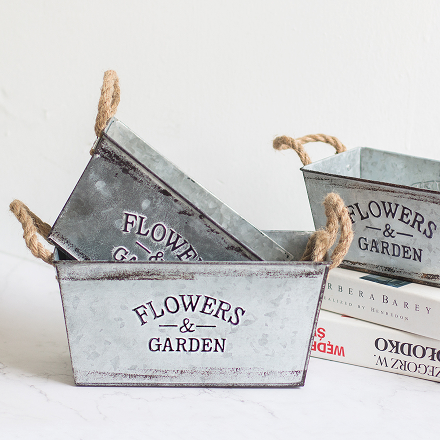 Decorative flower and garden container made of metal with hemp rope handles