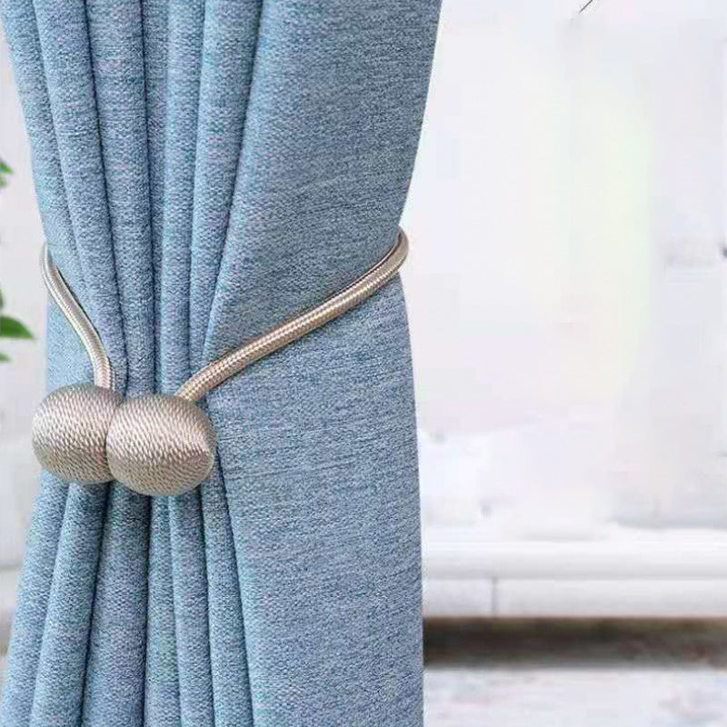 Curtain tiebacks with magnetic curtain clasp
