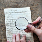 Necklace with magnifying pendant