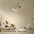 Industrial table lamp made of metal with adjustable arm and clock-shaped shade