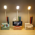 Desk lamp with phone holder
