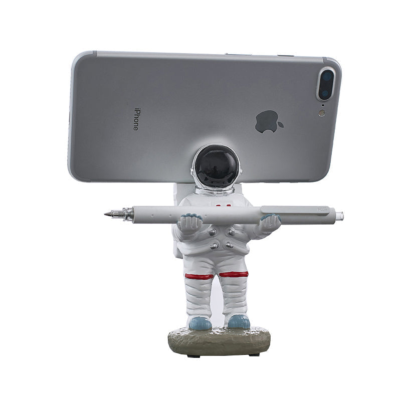 Support for phones or pens in astronaut decorations