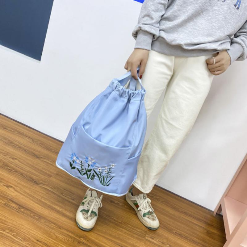 Multifunctional travel backpack with drawstring and embroidery