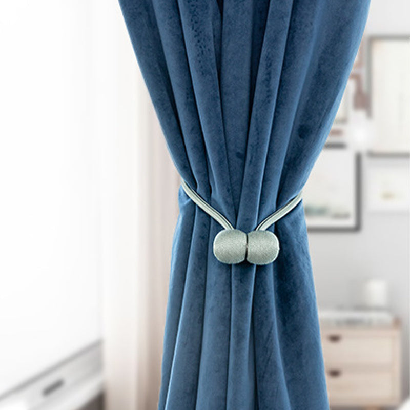 Curtain tiebacks with magnetic curtain clasp