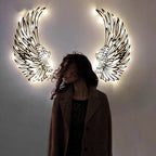 Metal wall art with angel wings and LED lights