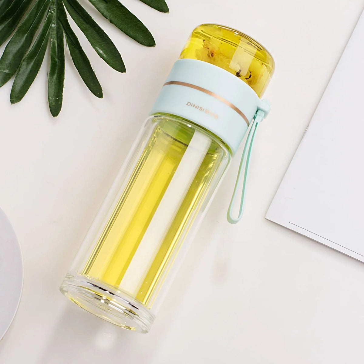 Double-walled glass bottle with tea strainer and infuser