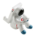 Support for phones or pens in astronaut decorations