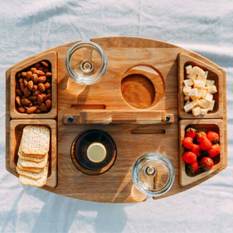 Compact picnic table with wooden bottle holder