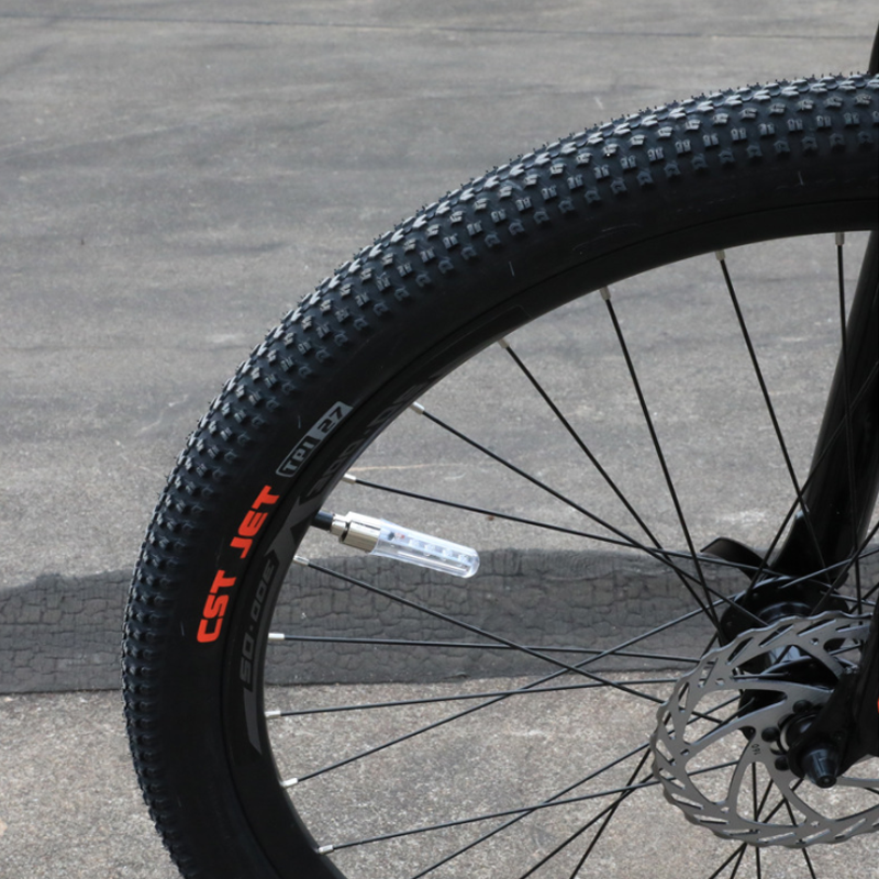 Bicycle tire flashing light