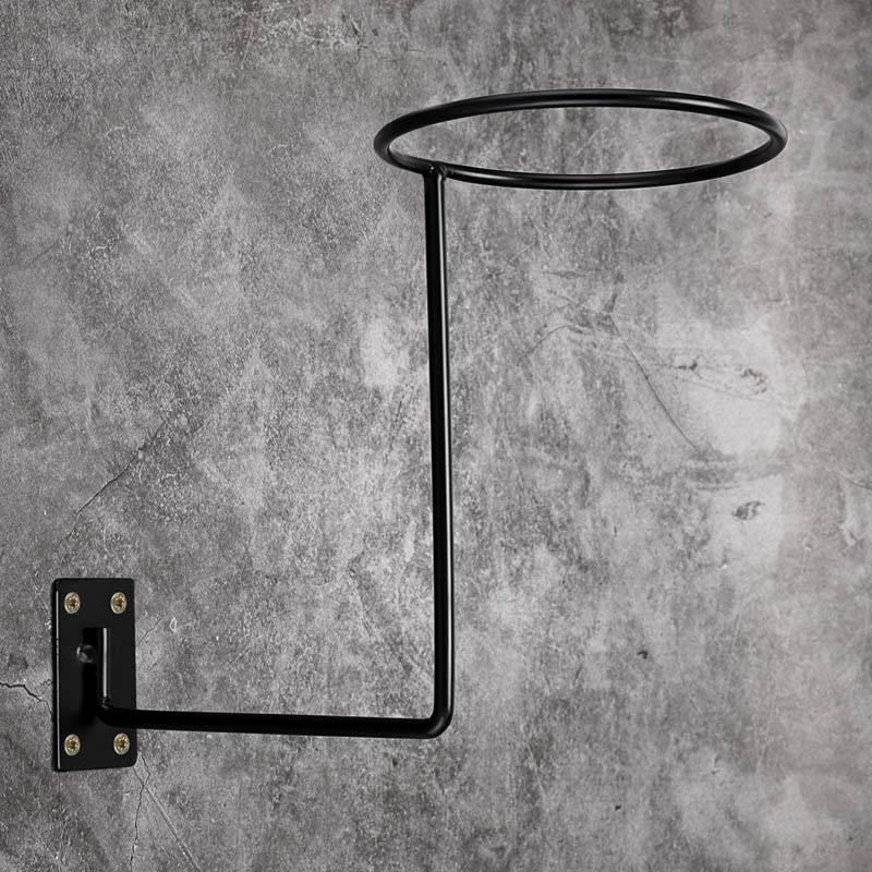 Wall-mounted helmet holder