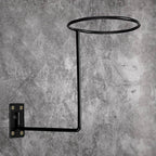 Wall-mounted helmet holder