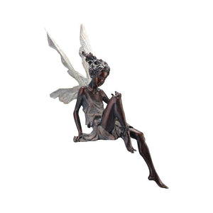 Statue of sitting fairy in the garden
