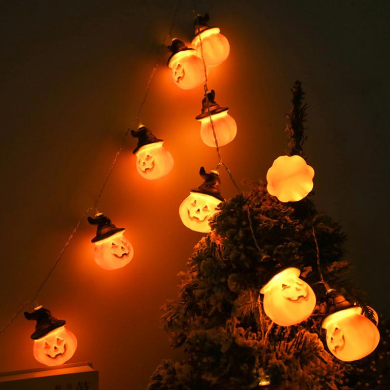 Glowing pumpkin garland Halloween with witch hats