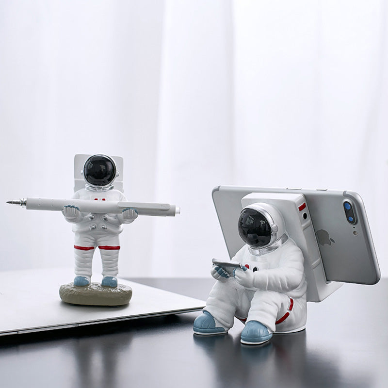 Support for phones or pens in astronaut decorations