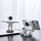 Support for phones or pens in astronaut decorations