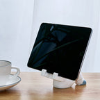 Support for phones or pens in astronaut decorations