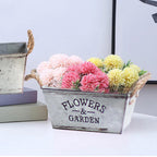 Decorative flower and garden container made of metal with hemp rope handles