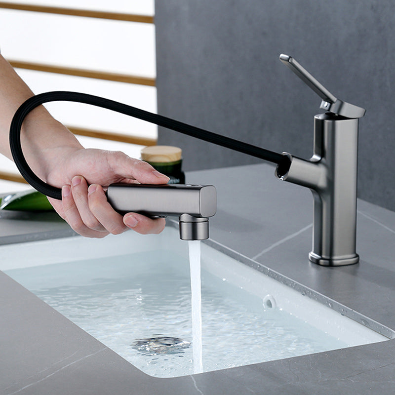 Modern bathroom sink faucet with brass lever handles and swivel spout