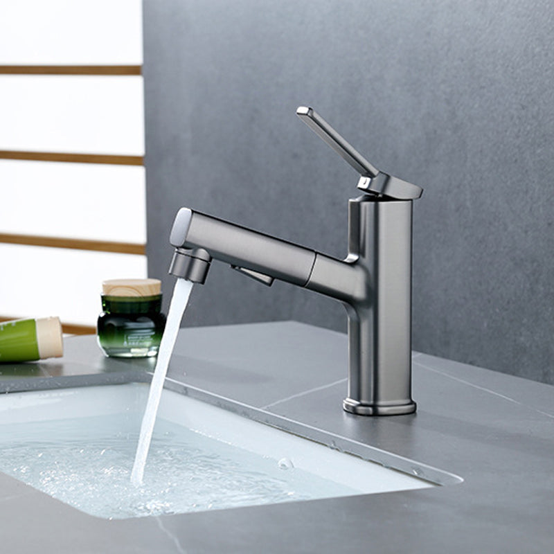 Modern bathroom sink faucet with brass lever handles and swivel spout