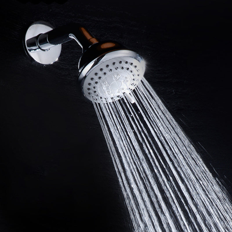 Round shower head made of stainless steel in silver wall-mounted shower head