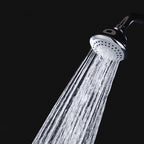 Round shower head made of stainless steel in silver wall-mounted shower head
