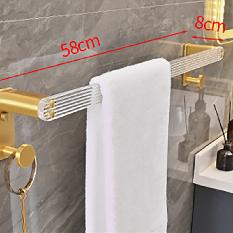 Metal and acrylic bathroom accessories as a single piece or in a set in gold