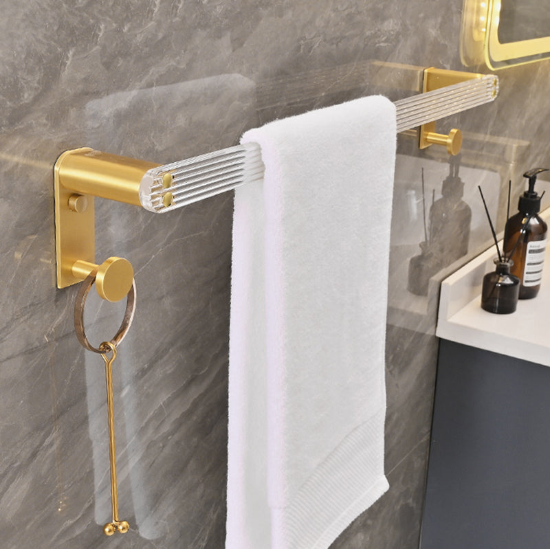 Metal and acrylic bathroom accessories as a single piece or in a set in gold