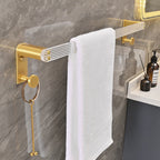 Metal and acrylic bathroom accessories as a single piece or in a set in gold