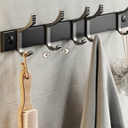 Contemporary bathroom accessory set with black finish and bath shelf/towel bar