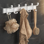 Modern white bathroom accessories as a single piece or in a set made of metal