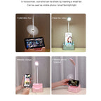 Desk lamp with phone holder