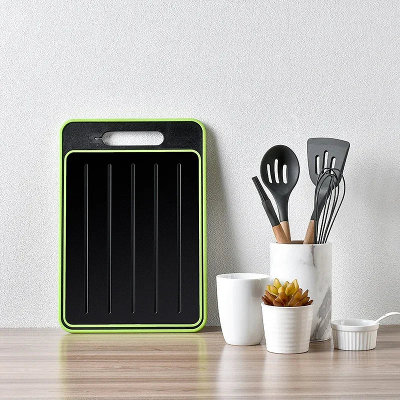 Double-sided cutting board with integrated defrosting plate
