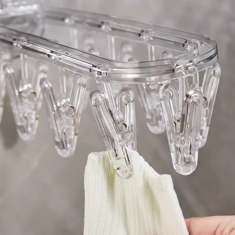Suction cup collapsible clothes hanger with clip