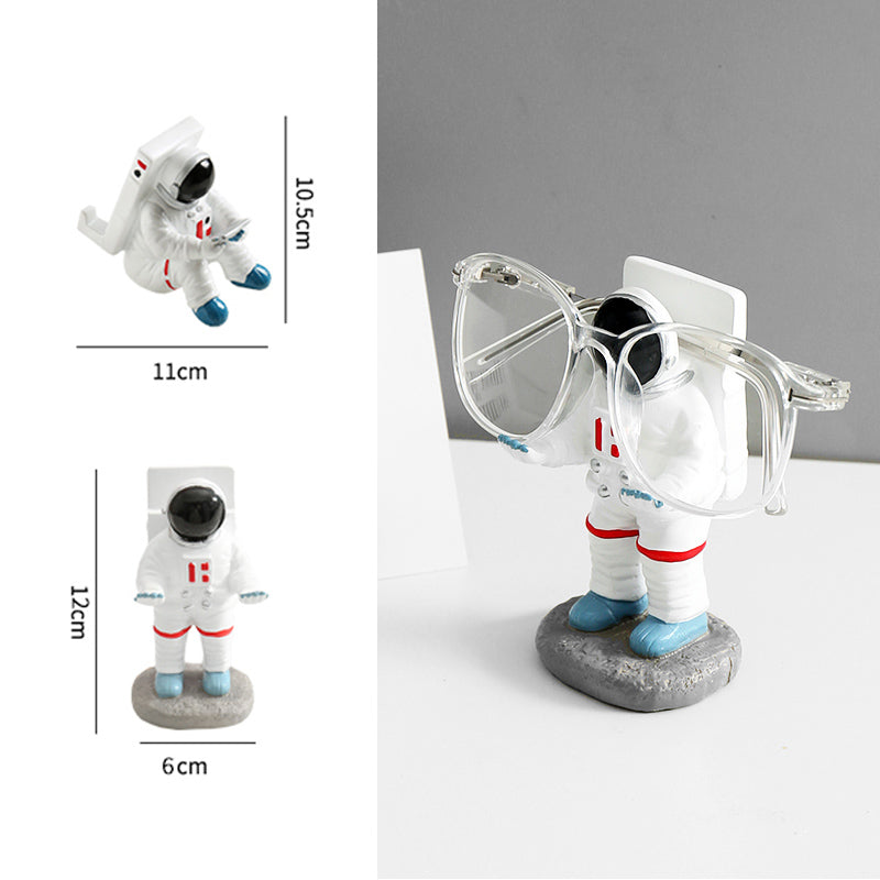 Support for phones or pens in astronaut decorations