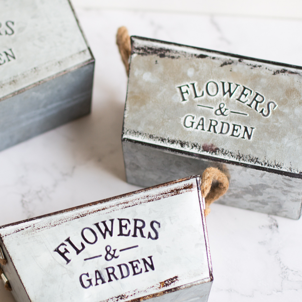 Decorative flower and garden container made of metal with hemp rope handles